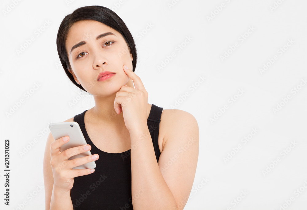 sad korean girl hold phone isolated over white sad korean girl hold phone isolated over white