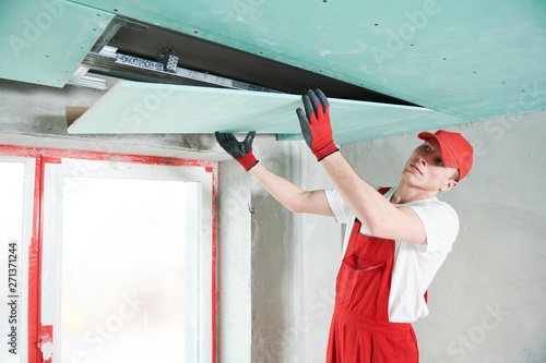 фотографія gypsum plasterboard construction work at suspended ceiling