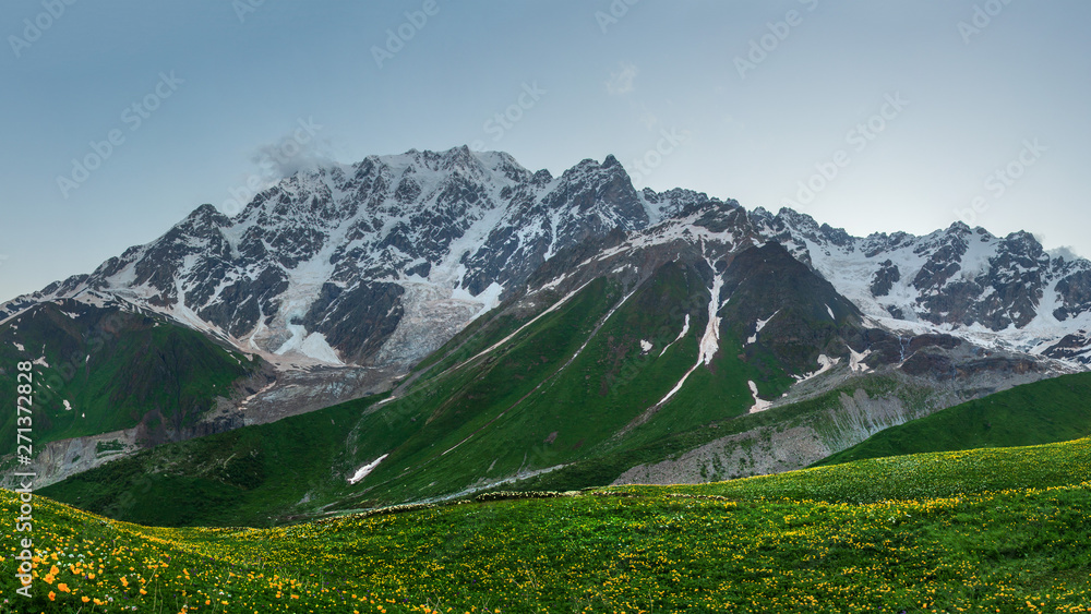 Mountains. Mountain landscape at dawn. Scenic rocky mountains with snowy summit