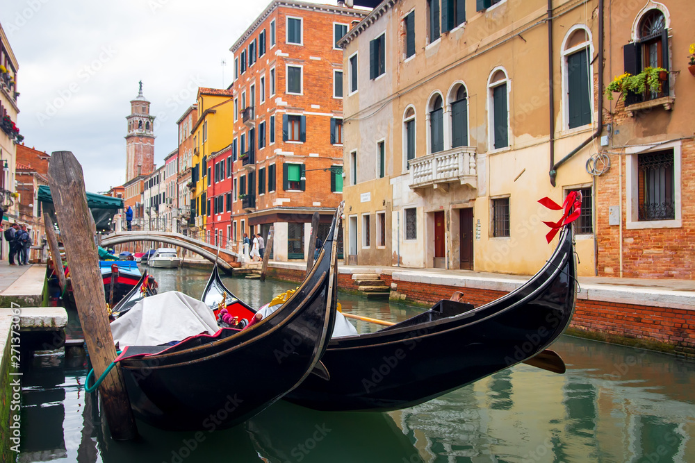 Gondolas in Venice canal. Venetian traditional gondola. Venezia cityscape, Italy