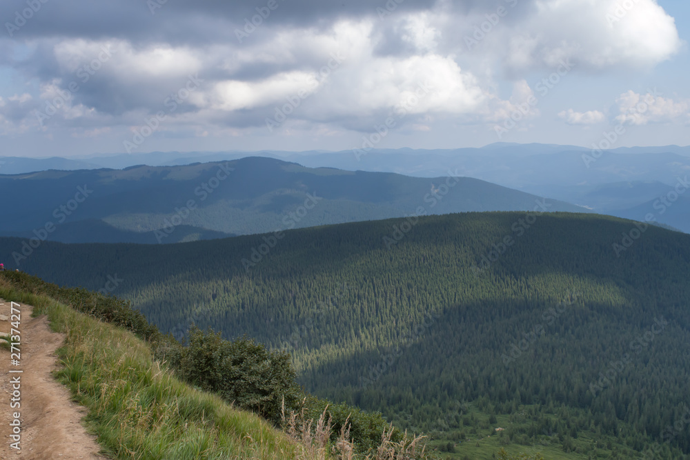 Panoramic view on thunderstorm clouds from Hoverla, Carpathian mountains, Ukraine. Horizontal outdoors shot