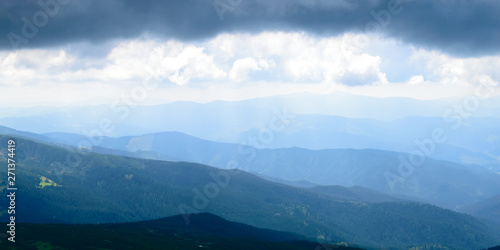 Panoramic view on thunderstorm clouds from Hoverla, Carpathian mountains, Ukraine. Horizontal outdoors shot © Vitali