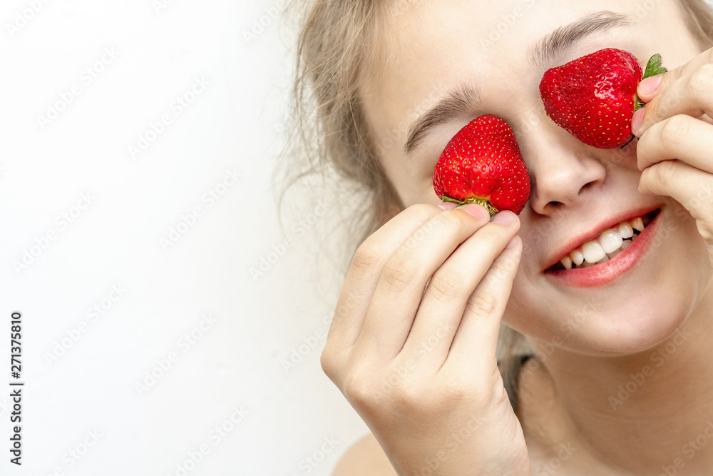 Strawberry Eyes . Beautiful young woman holding strawberries in eyes like binoculars. Healthy, lifestyle concept. Strawberry Eyes . Beautiful young woman holding strawberries in eyes like binoculars. Healthy, lifestyle concept.