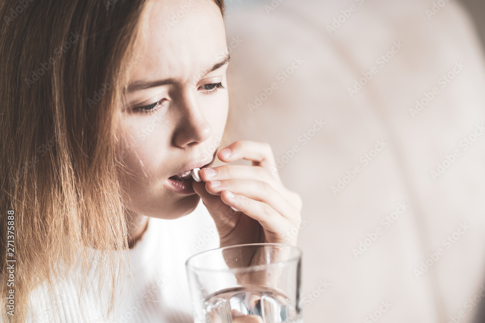 medicine, health care and people concept - close up of woman taking in pill medicine, health care and people concept - close up of woman taking in pill