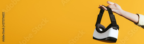 partial view of woman holdi...