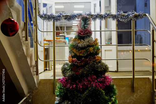 Designer Christmas tree in the office building photo