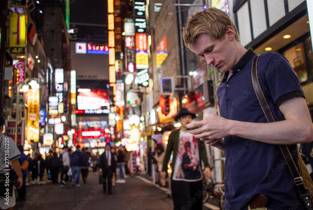 A handsome man looking at his phone A handsome man looking at his phone