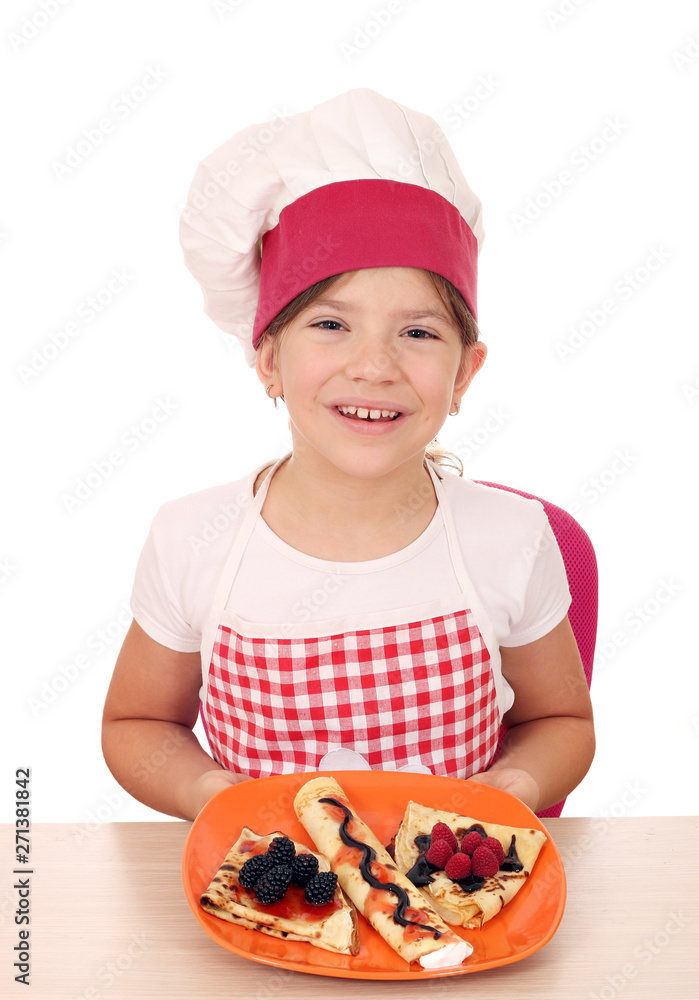 happy little girl cook with sweet crepes on plate happy little girl cook with sweet crepes on plate