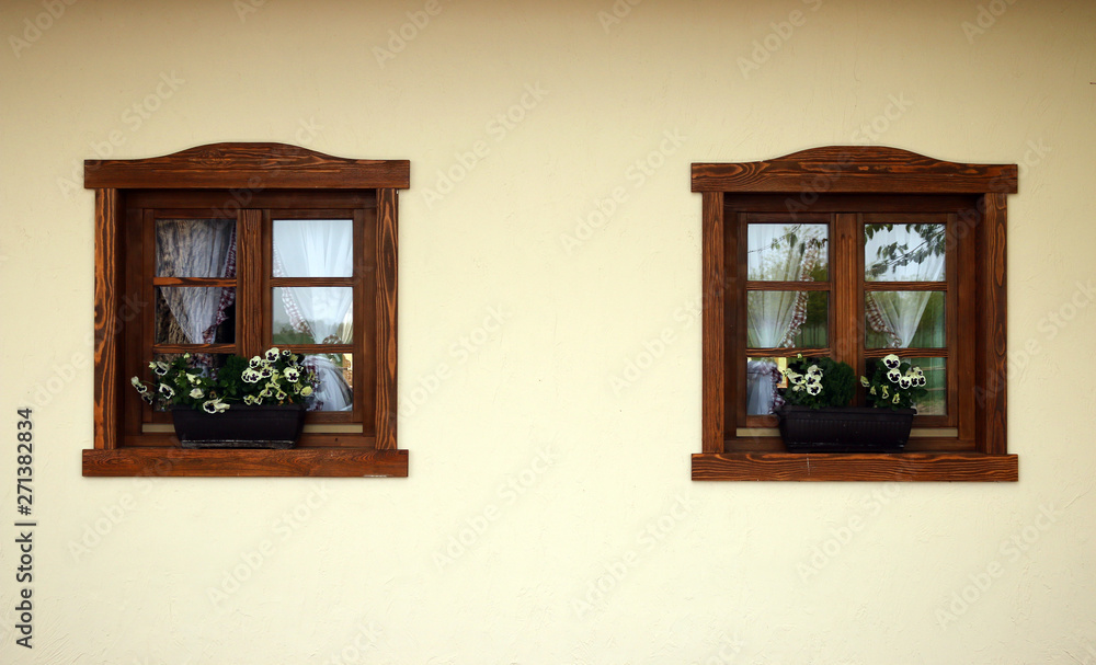 wooden windows and flowers old house detail wooden windows and flowers old house detail