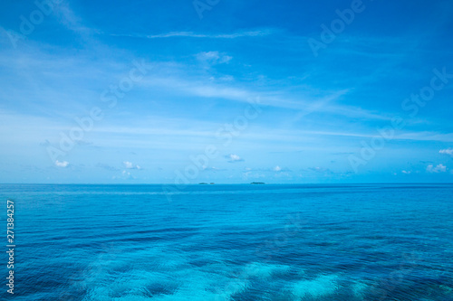 tropical Maldives island with white sandy beach and sea