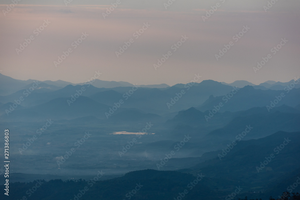 Beautiful mountain and morning sunrise over the sea of mist. Mon Sone View point , Doi Pha Hom Pok National Park in Chiang Mai,Thailand.