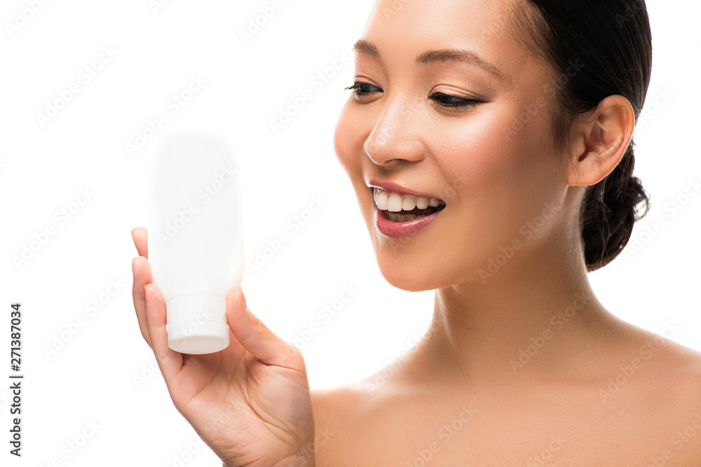 happy asian woman with bottle of lotion, isolated on white
