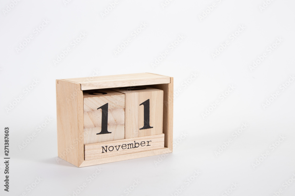 Wooden calendar November 11 on a white background Wooden calendar November 11 on a white background