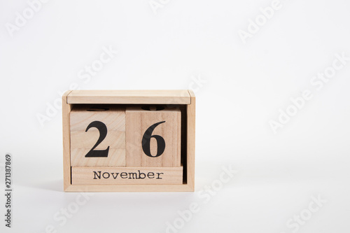 Wooden calendar November 26 on a white background