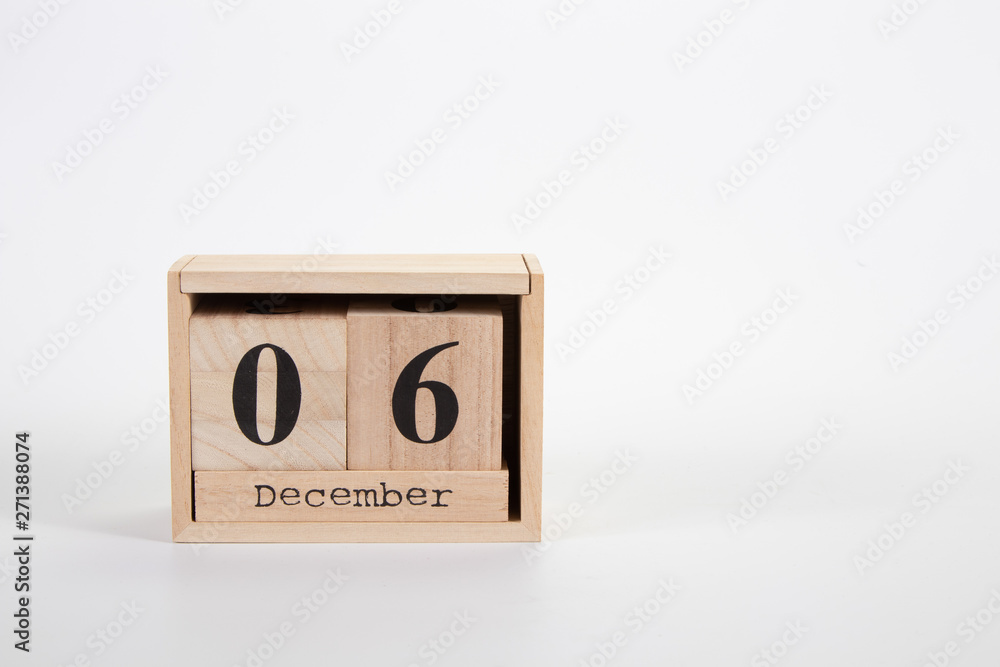 Wooden calendar December 06 on a white background Wooden calendar December 06 on a white background