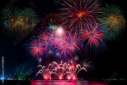 фотографія Amazing beautiful colorful fireworks display on celebration night, showing on th