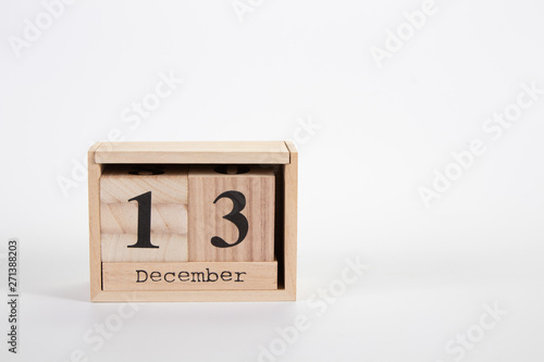 Wooden calendar December 13 on a white background