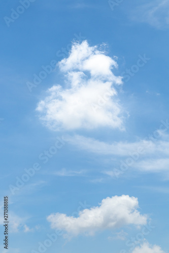 Blue sky background with white clouds.