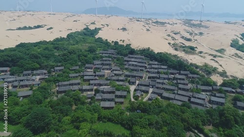 Chinese in eastern Jiangxi, Jiujiang, China largest freshwater lake in Poyang Lake. Aerial view of a small fishing village near the lake. photo