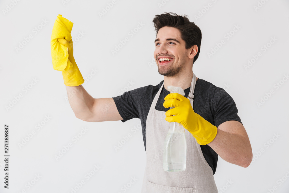 Handsome brunette houseman wearing apron Handsome brunette houseman wearing apron