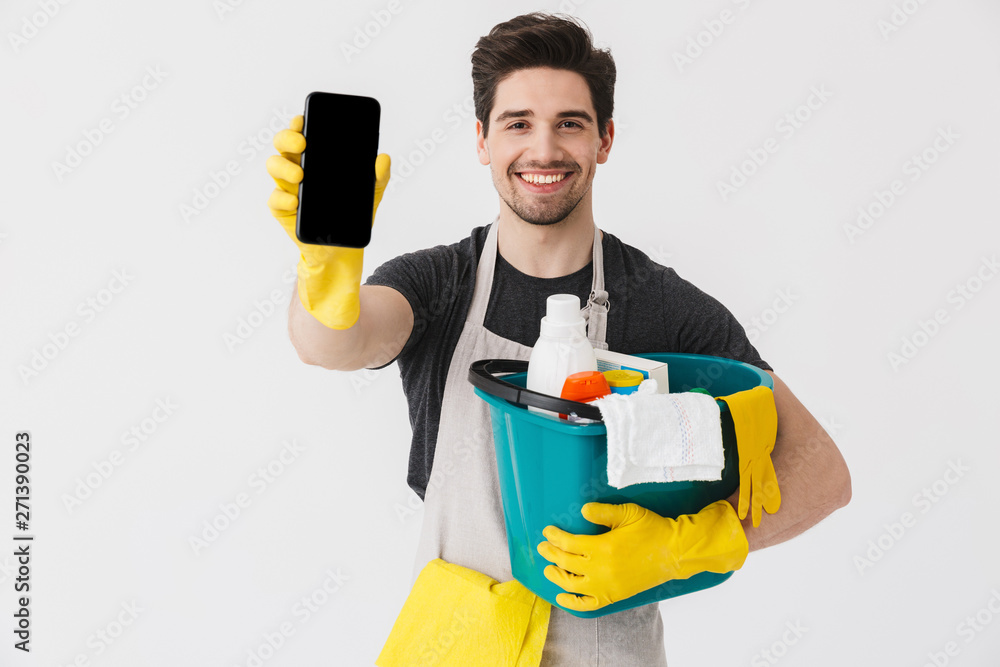 Handsome brunette houseman wearing apron Handsome brunette houseman wearing apron