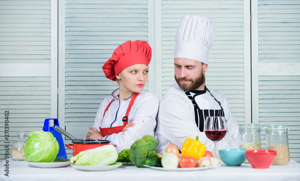 Reasons why couples cooking together. Cooking with your spouse can strengthen relationships. Ultimate cooking challenge. Couple compete in culinary arts. Woman and bearded man culinary partners Reasons why couples cooking together. Cooking with your spouse can strengthen relationships. Ultimate cooking challenge. Couple compete in culinary arts. Woman and bearded man culinary partners