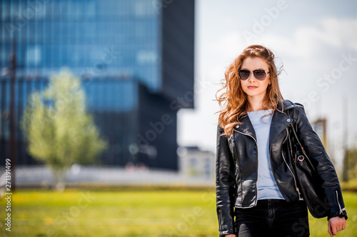 Woman in big modern city walking on the street