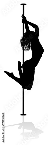 A woman pole dancer exercising for fitness in silhouette