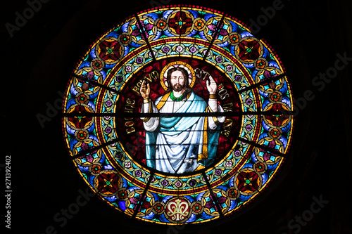 Rosette window in a church with God in  the center. Romanesque Art in Europe.