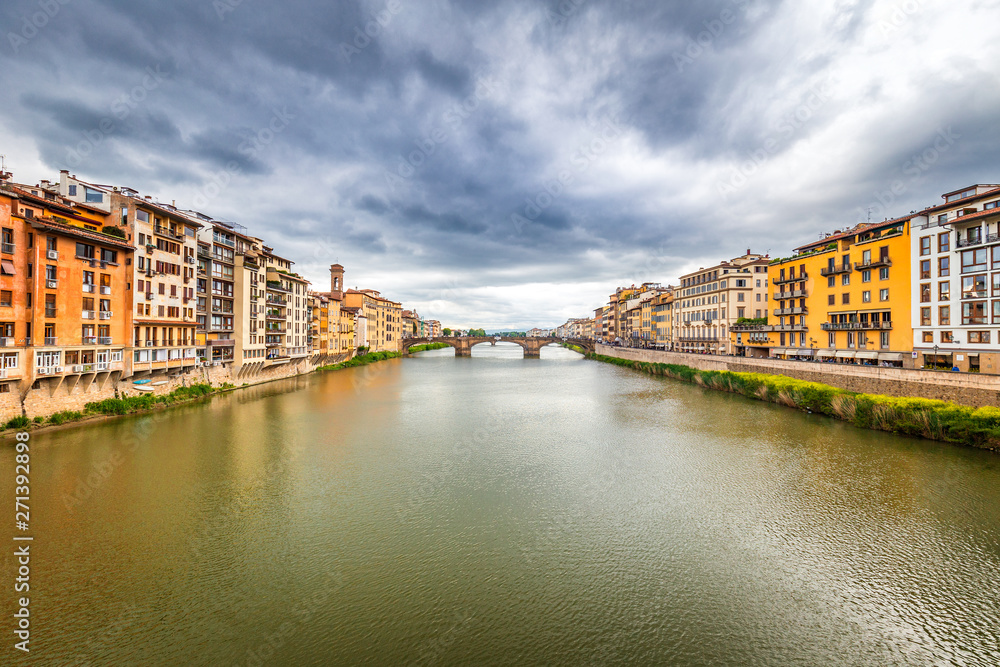 View of the Arno river from the famous bridge The Ponte Vecchio in Florence, Italy.
