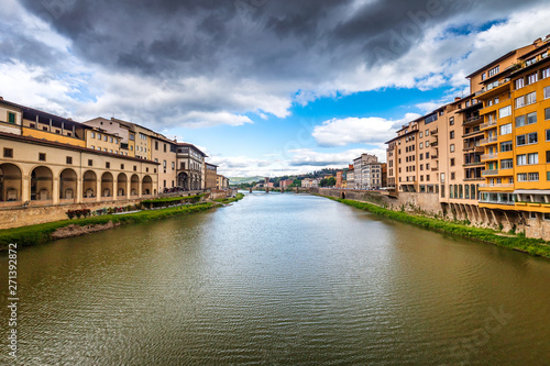 View of the Arno river from the famous bridge The Ponte Vecchio in Florence, Italy.