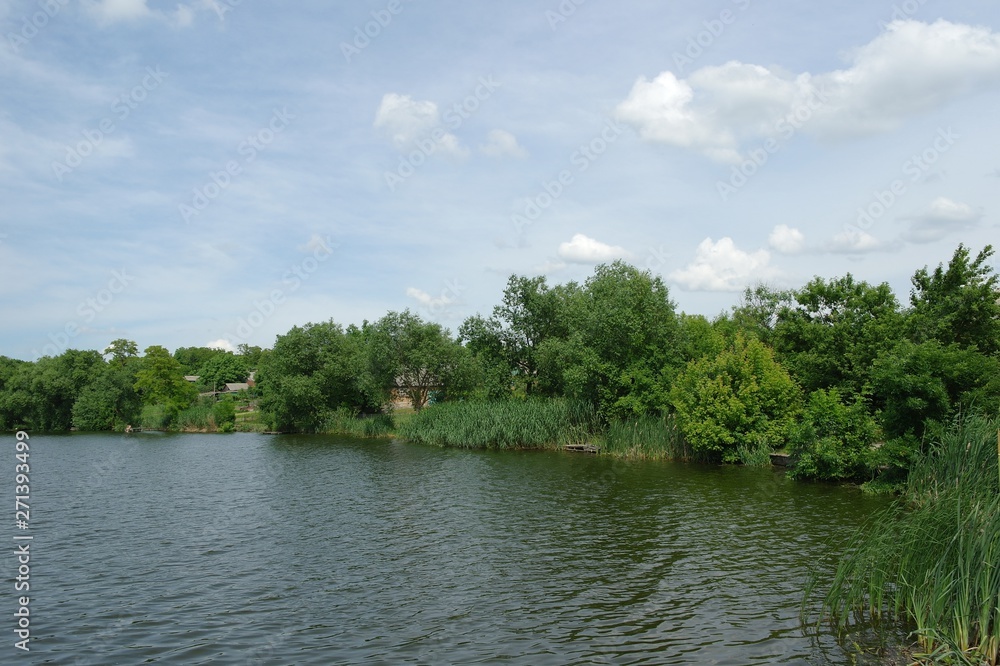 Summer landscape with river and clouds. Rural landscape. Summer landscape with river and clouds. Rural landscape.