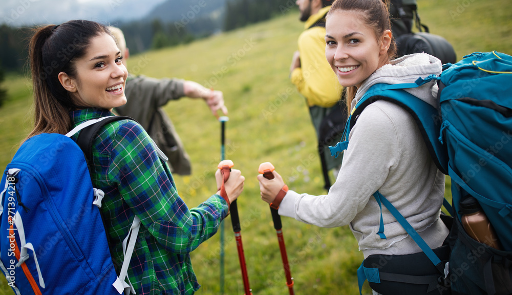 Group of friends on a mountain. Men and women climbing rocks. Group of friends on a mountain. Men and women climbing rocks.