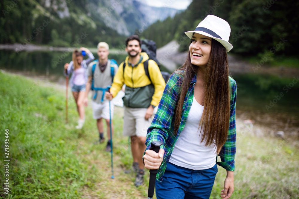 Hiking with friends is so fun. Group of young people with backpacks hiking together