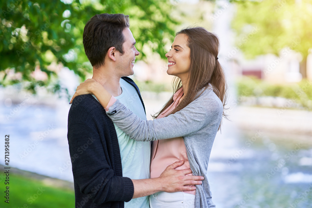 Fototapeta premium Young couple strolling in the park