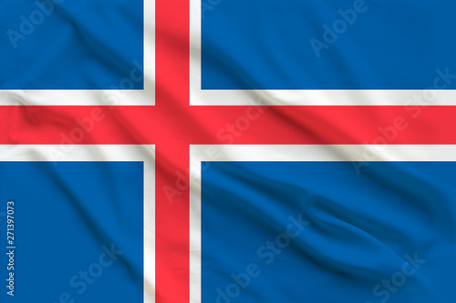 Beautiful silk flag of the state of Iceland with soft folds in the wind.