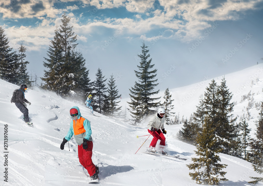 Group of friends snowboarders having fun on the top of mountain in Sheregesh resort