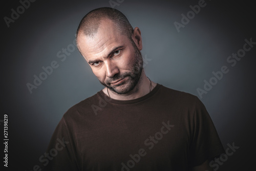 Photography Portrait of man with confident and threatening look.