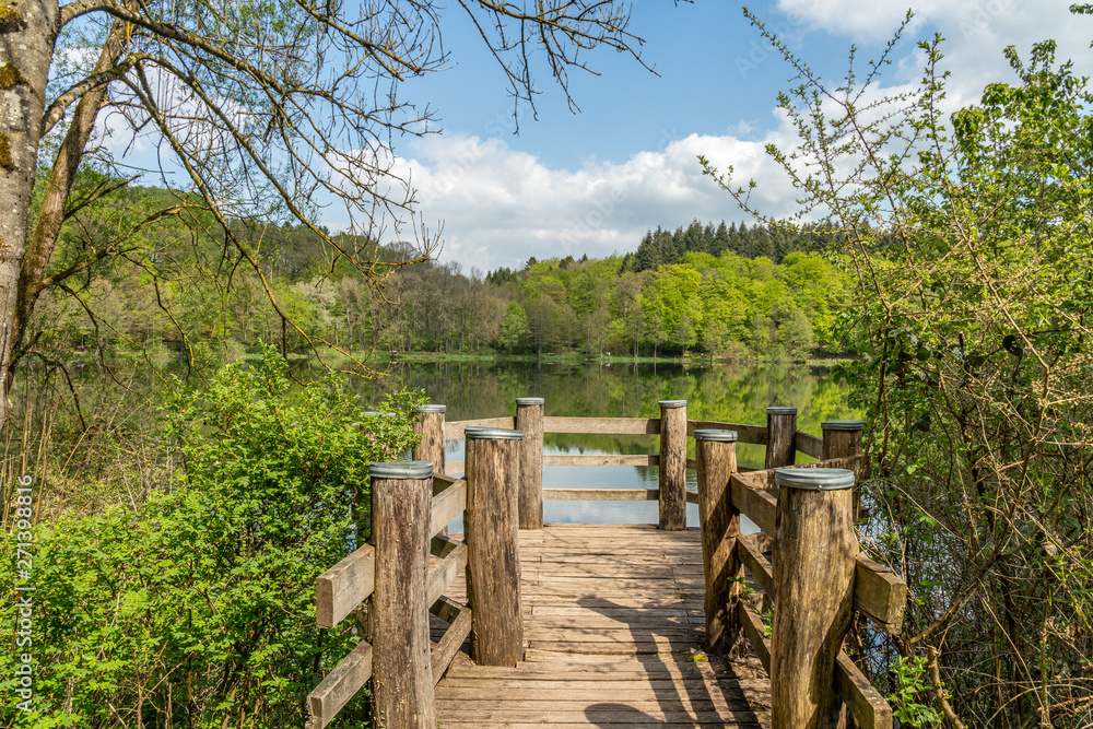 wooden jetty at holzmaar, eifel, germany