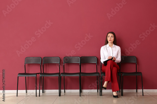 Young woman waiting for job...