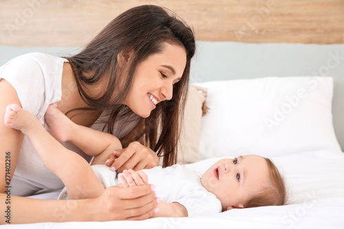 Happy mother with cute litt...