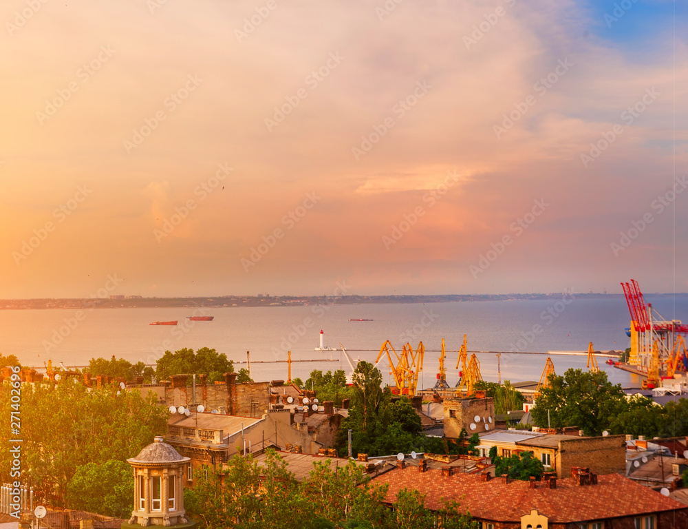 View of the city and the port from above. roofs of old houses and a lighthouse in the bay of the Black Sea. Ukraine. Odessa.