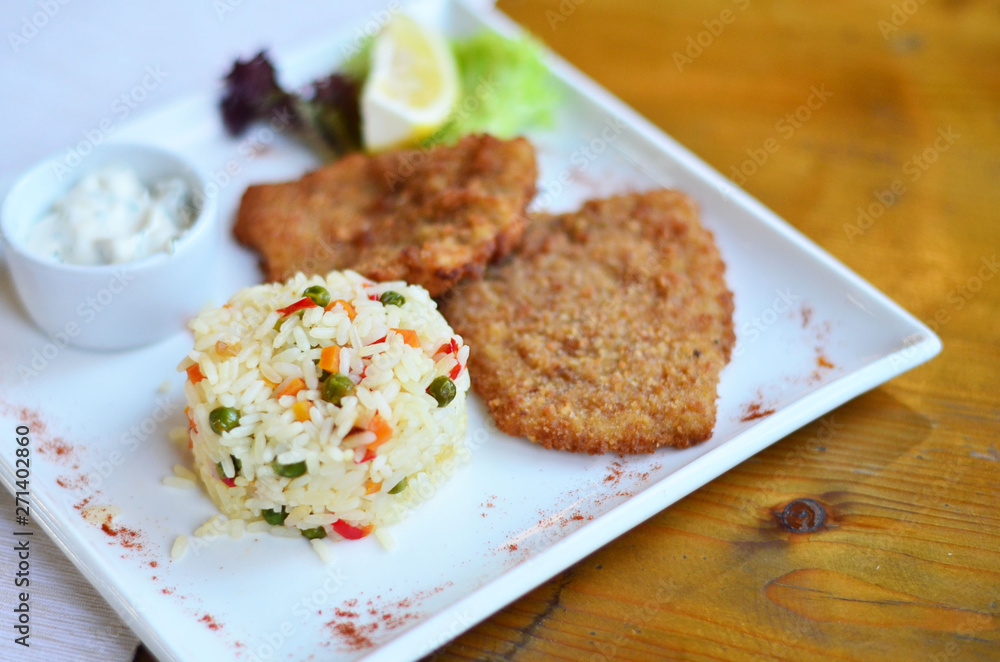 rice with vegetables with a piece of fish rice with vegetables with a piece of fish