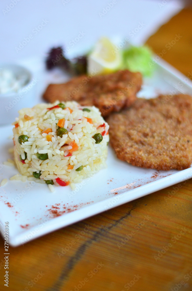 rice with vegetables with a piece of fish