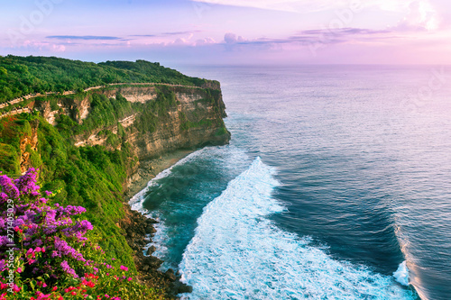 View of Uluwatu cliff with pavilion and blue sea in Bali, Indonesia photo
