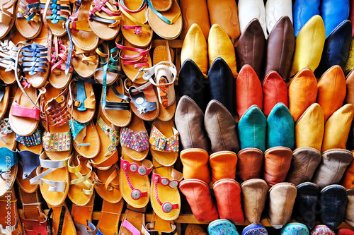 Street market in Chefchaouen, Morocco. Colourful Moroccan slippers. © Andrii Vergeles