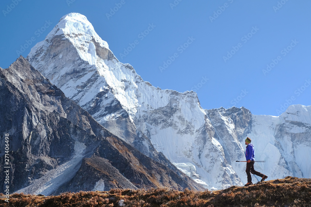 Hiking in Himalaya mountains. Man Traveler backpacker hiking in the Mountains. mountaineering sport lifestyle concept