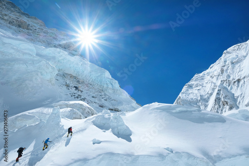 A group of climbers ascending a mountain Everest (8848), Nepal. 