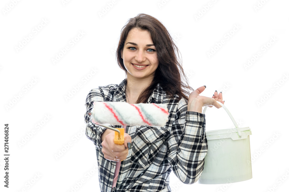 Young woman with painting tools isolated on white Young woman with painting tools isolated on white