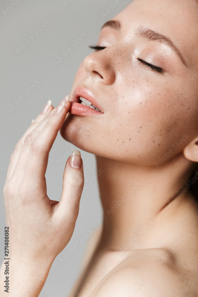 Beauty portrait of an attractive young topless redhead woman